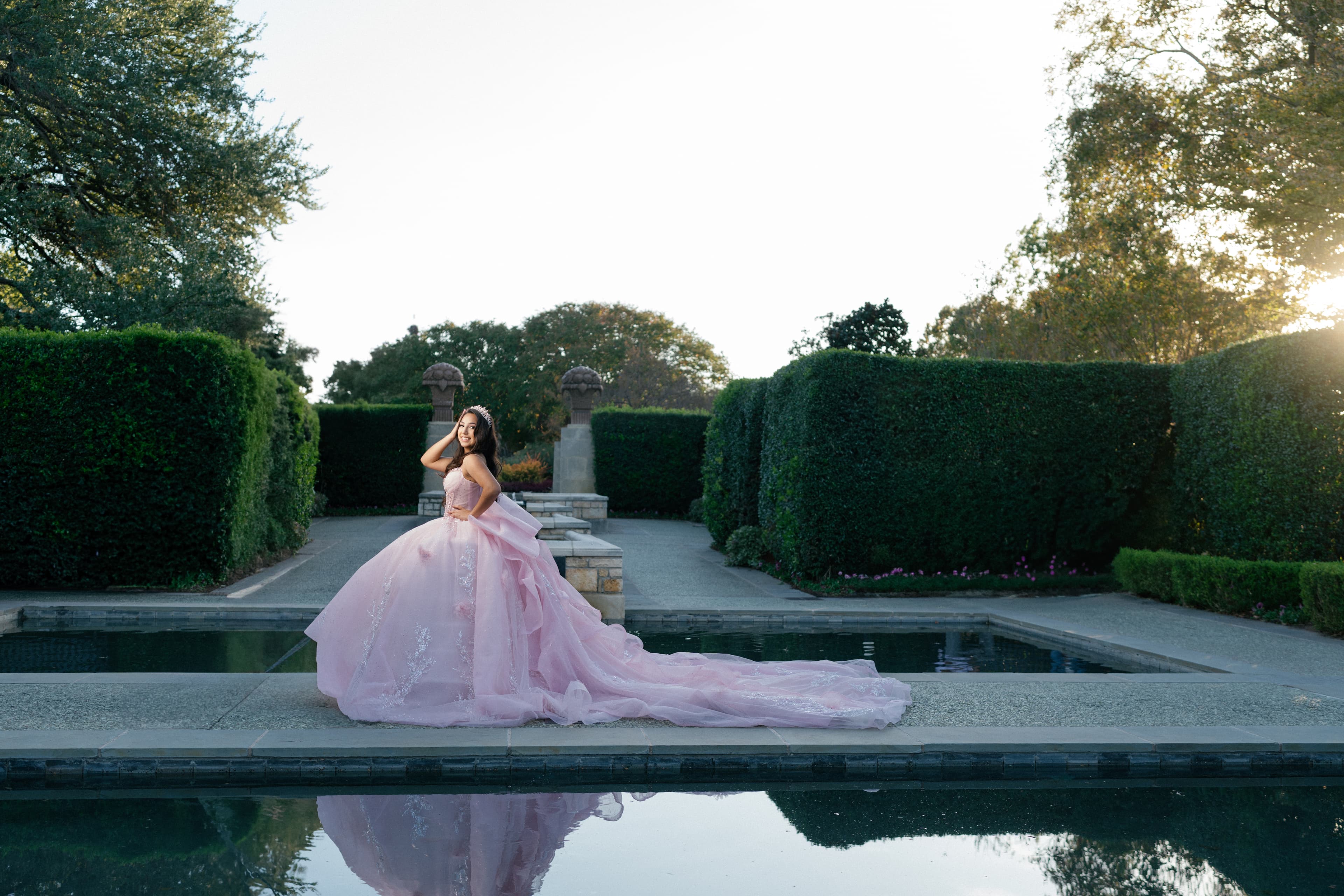 Dallas Quinceañera Photography - Young woman in pink ball gown at Dallas Arboretum